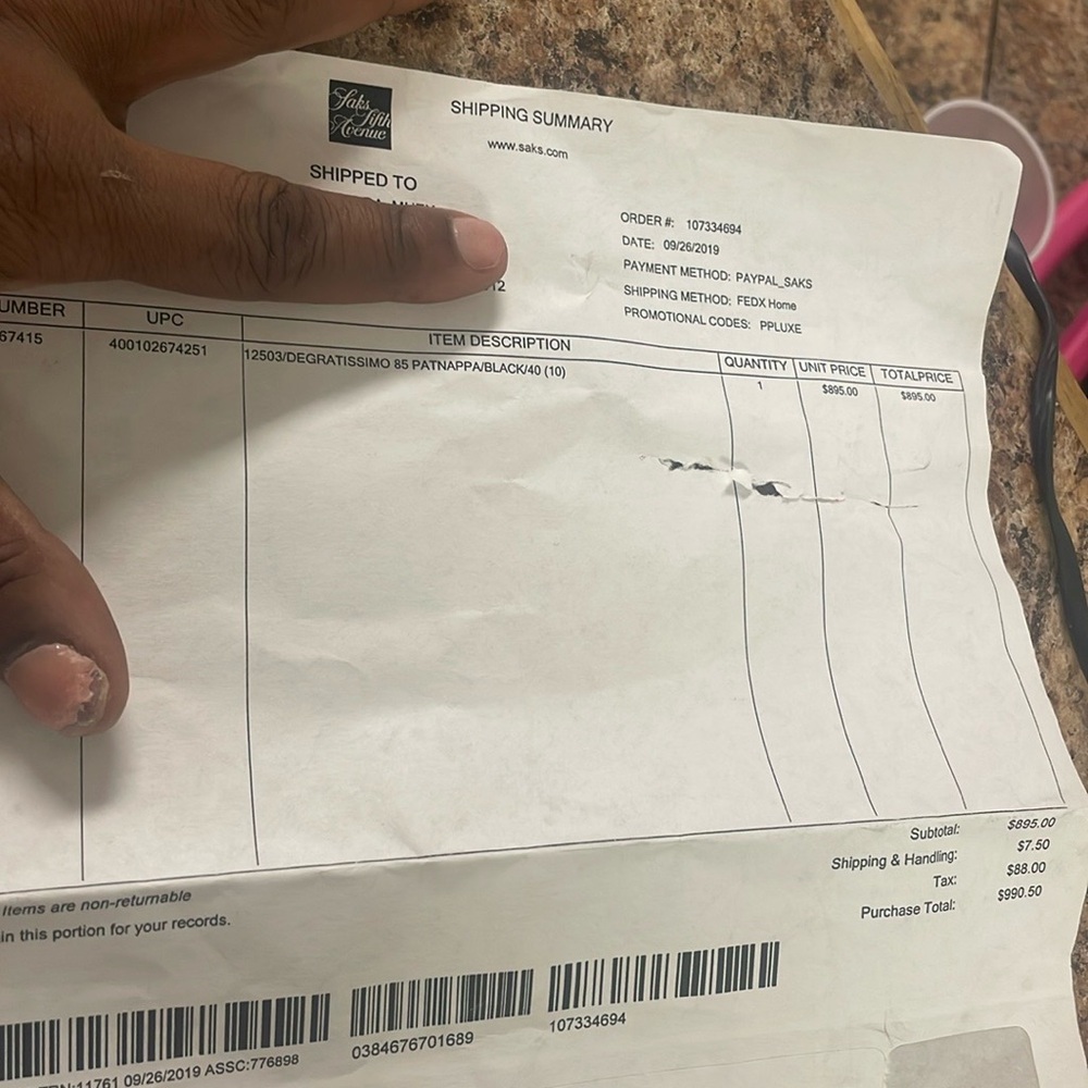 Black Christian Louboutin heels with strap